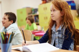 students-sitting-her-desk-during-lesson_i