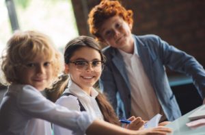 school-three-cute-kids-studying-classroom-feeling-excited_i