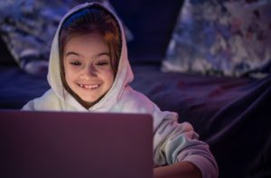 little-girl-uses-laptop-late-night_i